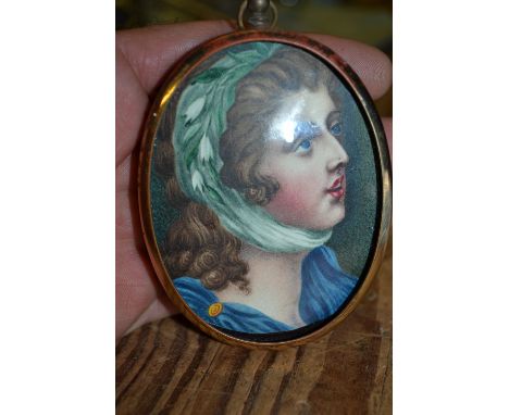Small oval head and shoulder portrait miniature of a lady with green headdress, unsigned, 3ins x 2.25ins