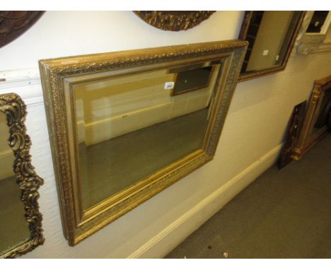 Late 19th Century rectangular gilded framed wall mirror with bevelled plate, 24ins x 17ins, together with another marquetry f