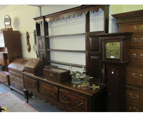 George III oak dresser with a boarded shelf and panelled door back, the base with chequer inlaid drawers with brass swan neck