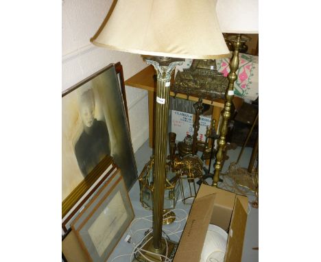 Edwardian brass Corinthian column lamp standard together with an oval gilt framed wall mirror
