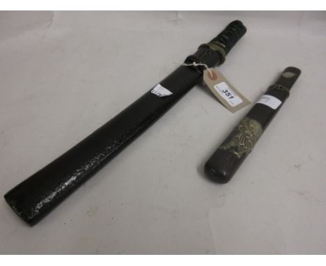 Japanese short sword having shagreen grip and brass fittings in a wooden scabbard, together with a small Japanese dagger in w