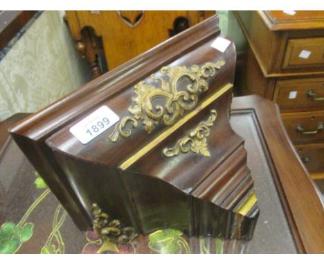 19th Century mahogany wall bracket with applied gilded decoration (the cover sliding to reveal fixings), 10.5ins x 6.5ins