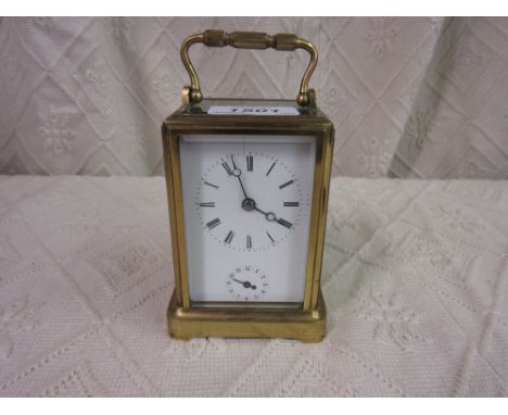 Early 20th Century French gilt brass gorge case carriage clock, the enamel dial with Roman and Arabic numerals with subsidiar