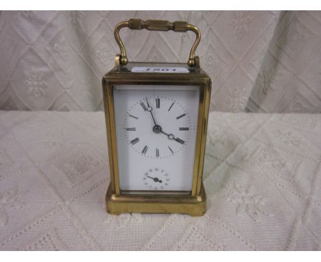 Early 20th Century French gilt brass gorge case carriage clock, the enamel dial with Roman and Arabic numerals with subsidiar