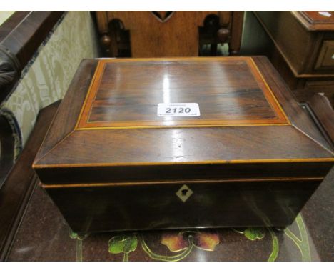 19th Century rosewood and boxwood inlaid sarcophagus shaped tea caddy, with lion's head and ring handles on low ball supports