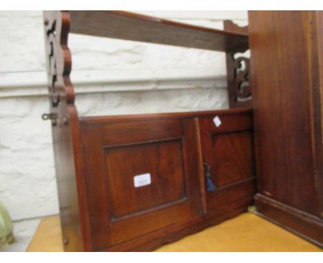 Late Victorian walnut wall bracket with an open shelf above two panel doors