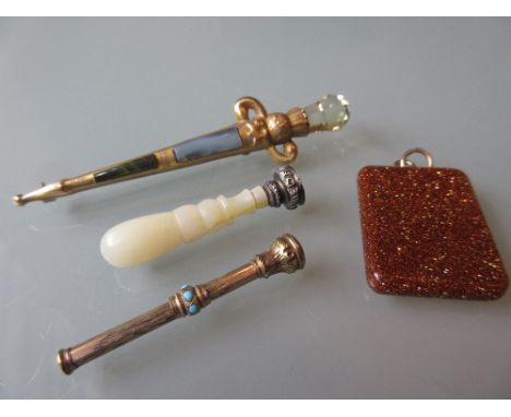 Scottish 9ct gold stone set brooch in the form of a dirk, a bloodstone pendant, mother of pearl seal and a small propelling p