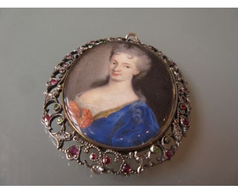 George III oval portrait miniature of a lady housed in a fine pierced foliate frame set rubies, diamonds and emeralds