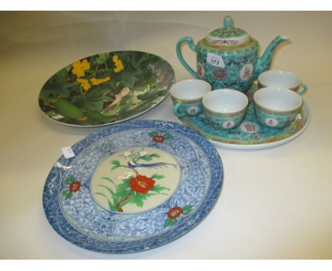 20th Century Chinese tea service for two on a circular tray together with two decorative plates
