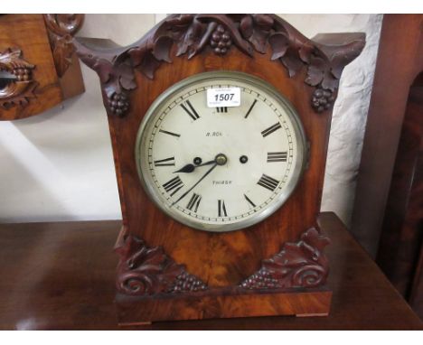 19th Century mahogany bracket clock, the shaped vine leaf decorated case with a circular painted dial, Roman numerals and two