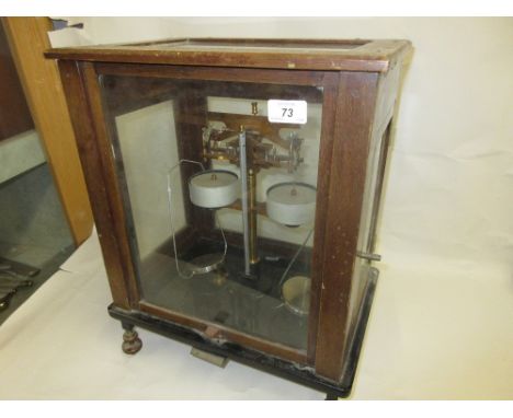 Pair of early 20th Century mahogany and glass cased laboratory scales by Sutherland Thomson and Co., Wells
