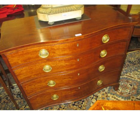 George III mahogany serpentine fronted chest, the boxwood line inlaid top above four graduated drawers with circular brass ri