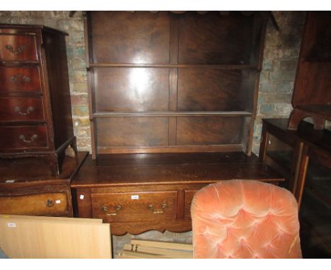 Early 20th Century oak dresser with a boarded shelf back above two drawers on turned supports