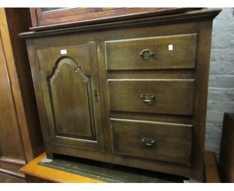 Reproduction oak dresser, the boarded shelf back above three drawers and a single fielded panel door