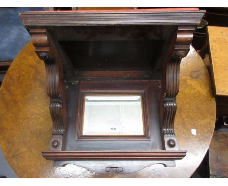 Large early 20th Century walnut clock bracket with bevelled mirror insert