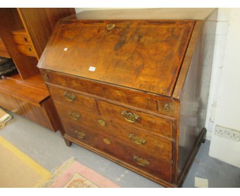 18th Century walnut herringbone crossbanded bureau, the fall front housing a fitted interior above two short and two long dra