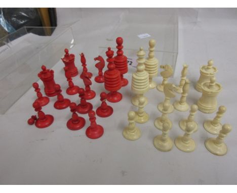 Late 19th / early 20th Century white and red stained turned ivory chess set (a/f)