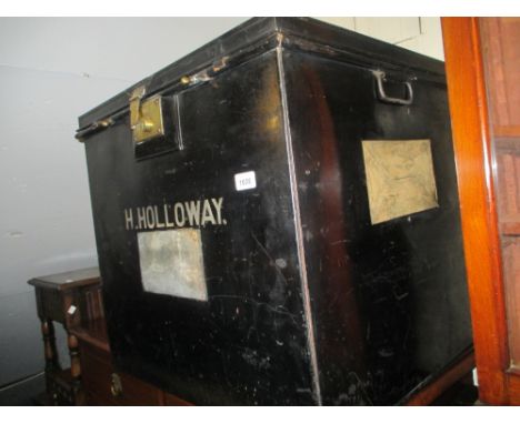 19th Century black toleware trunk with brass mounts together with two similar metal trunks