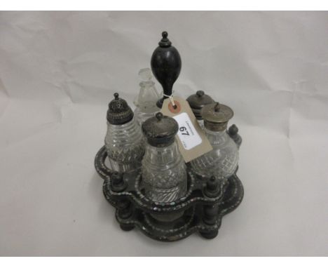 Victorian papier mache lacquer and mother of pearl inlaid cruet stand with cut glass and silver mounted condiments