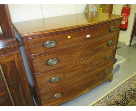 George III mahogany and line inlaid bow fronted chest of four graduated drawers with oval brass handles raised on bracket sup