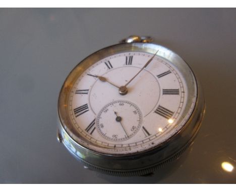 935 Continental silver cased pocket watch having ceramic dial with Roman numerals and subsidiary seconds, with key