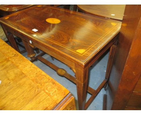 Edwardian rectangular rosewood shell and line inlaid side table on square tapering supports with brass and ceramic casters