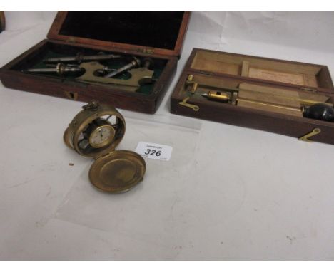 Brass cased pocket anemometer by Schaffer and Budenberg, Manchester, together with two other mahogany cased instrument sets