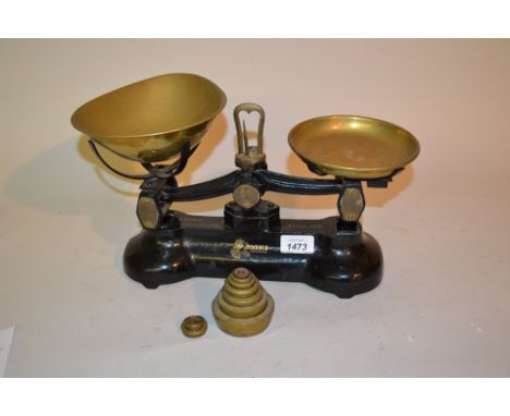 Pair of cast iron and brass balance scales with weights