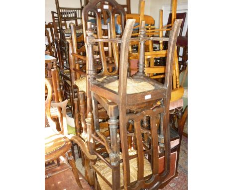 Harlequin set of six 18th / 19th Century elm ladder back dining chairs with rush seats together with a pair of splat back rus