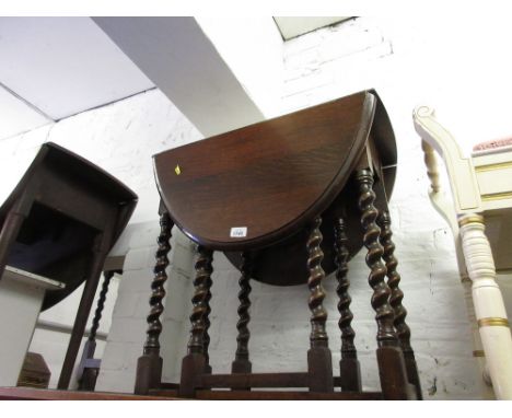 Early 20th Century oak oval gate leg table on barley twist supports and a small reproduction oak joint stool