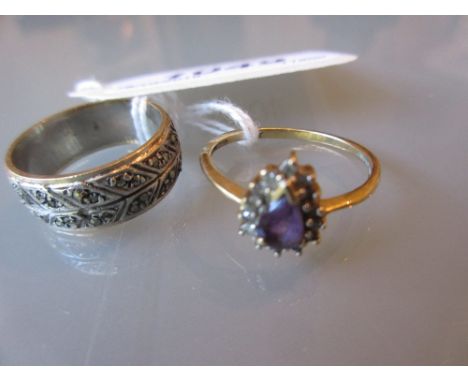 Gold marcasite set ring and an amethyst coloured stone set 9ct gold ring