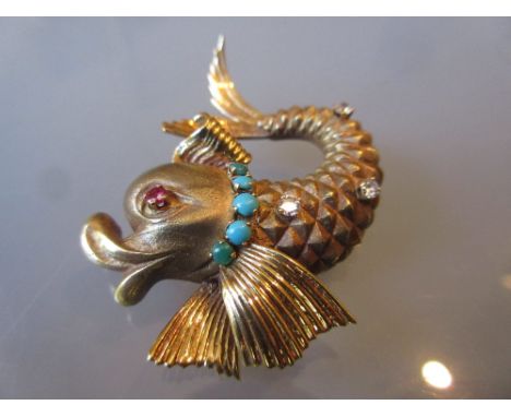 Continental yellow metal dolphin form brooch, set turquoise, diamonds and a ruby