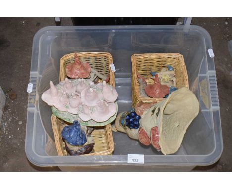 A group of modern ceramic pixie models, wicker baskets and other items