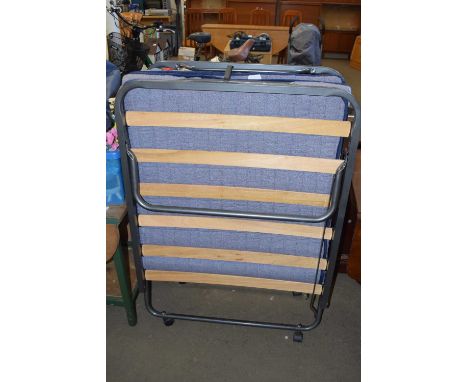 A folding guest bed