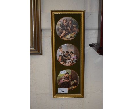 Frame containing three ceramic decorative plaques