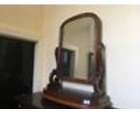 A Victorian mahogany swing mirror.