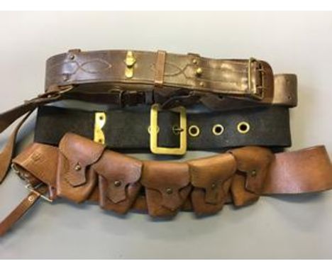 WWI Sam Brown belt, ammunition belt, and a canvas fireman's belt with brass buckle.