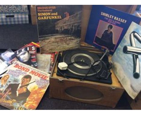 A Clarke & Smith Mfg Co record player with a large selection of LPs including tubular bells, Bond movie, with and Ellis memor