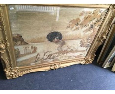 A large guilt framed tapestry of a dog sitting
