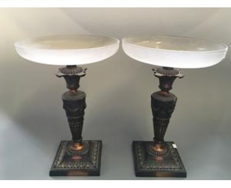 Two bronze finished swag decorated stands with frosted topped glass bowls