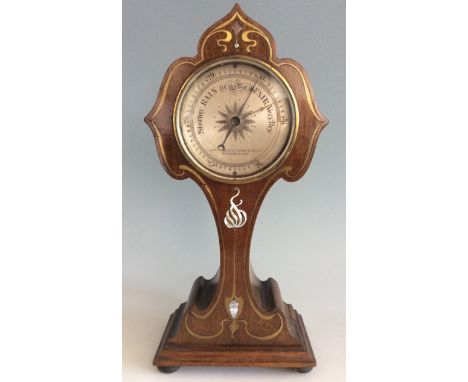 A mahogany clock case with Art Nouveau style brass and pearl inlay and later barometer insert.