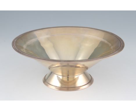 A silver dish, of circular tapered form and raised on circular foot, hallmarked Sheffield 1937, with makers mark R&B for Robe