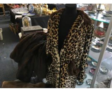 Collection of fur coats, including a leopard print coat.