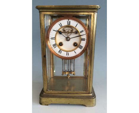 A brass mercury filled four glass panelled R&C 1061 mantel clock.
