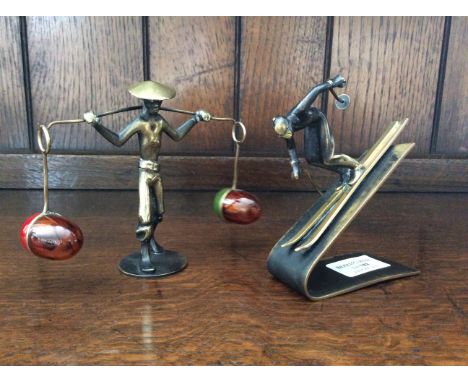 Bronze cruet set in the form of water carrier and skiing figurine sculpture, designed by Richard Rohac, made in Austria.