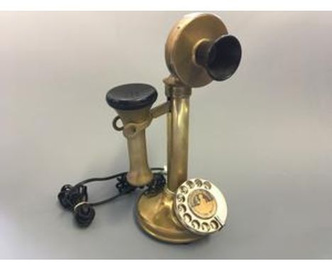 A brass stick telephone.