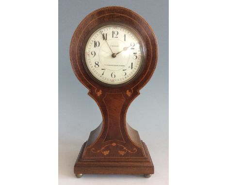 A mahogany C.E. Court Ulverston, Kendal & Grange mantel clock with inlay design.