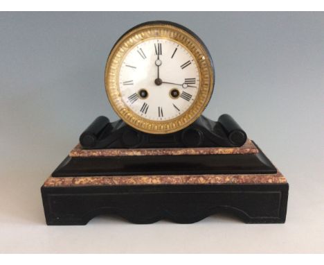 A black slate 1300 mantel clock with marble design.