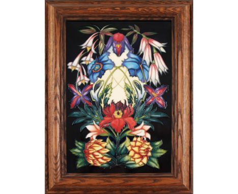 A Moorcroft floral plaque on dark blue background, signed Philip Gibson, 124/250, 30cm X 20cm.