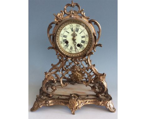 A Medaille d'Or Gustav Becker 1139297 onyx and brass cased mantel clock.
